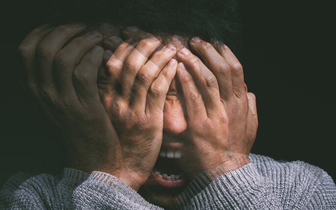 Bildet viser et nærbilde av en mann med psykose