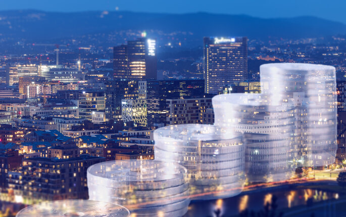 Bildet viser et oversiktsbilde av Oslo med grafikk av mynter i stabler