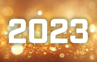 Bildet viser gult glitter og årstallet 2023