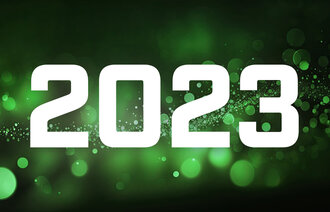 Bildet viser grønt glitter og årstallet 2023
