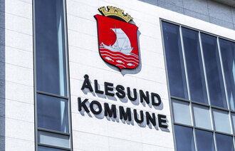 Bildet av et skilt med Ålesund kommune