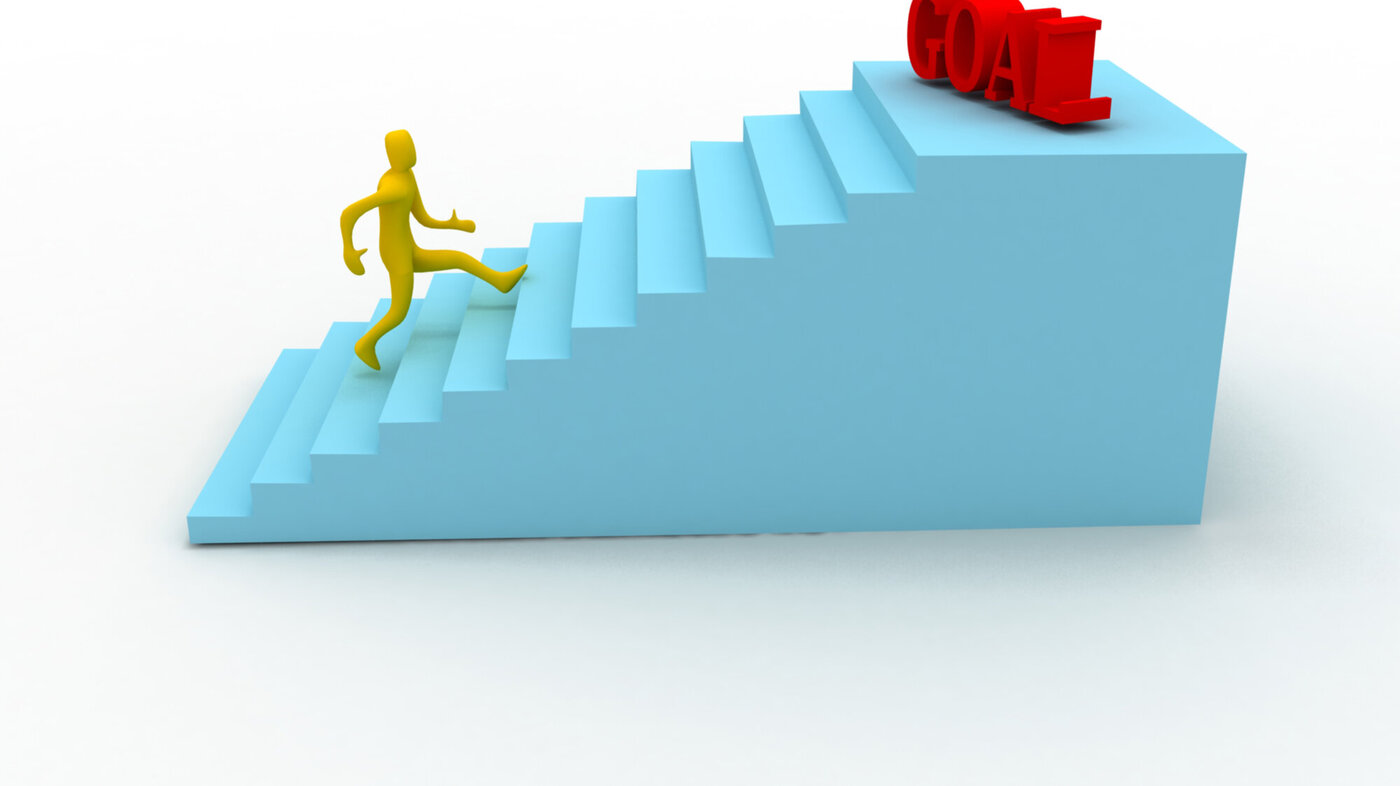 Illustrasjonen viser en mann på vei oppover en trapp, og så står det «goal» på toppen av trappen.